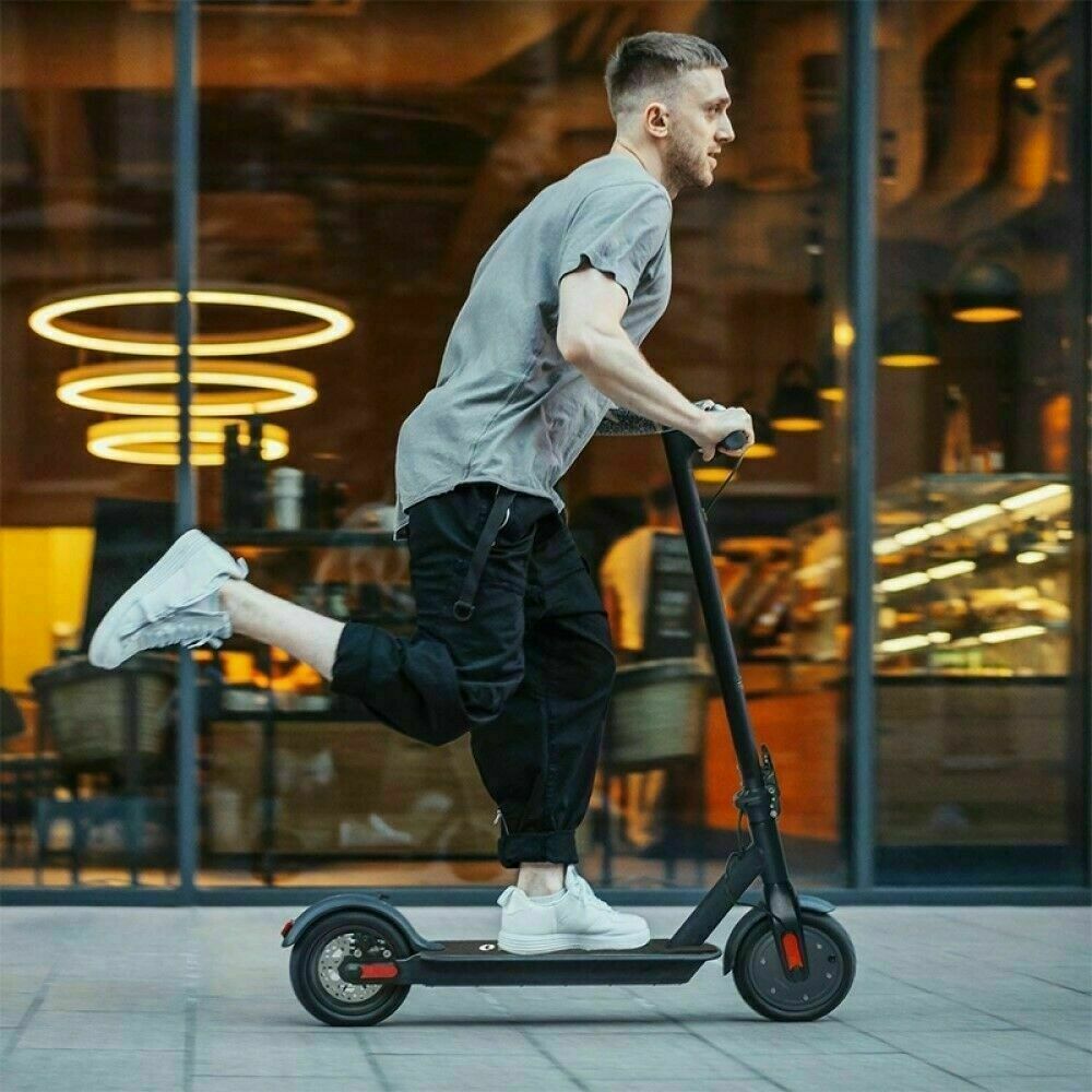 guy riding a fast electric scooter